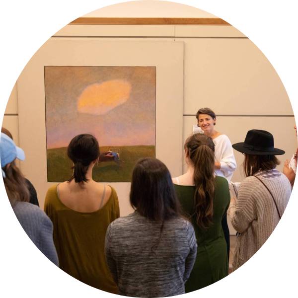 Alexa Miller talking to a group of nursing students about a Stephen Duren painting